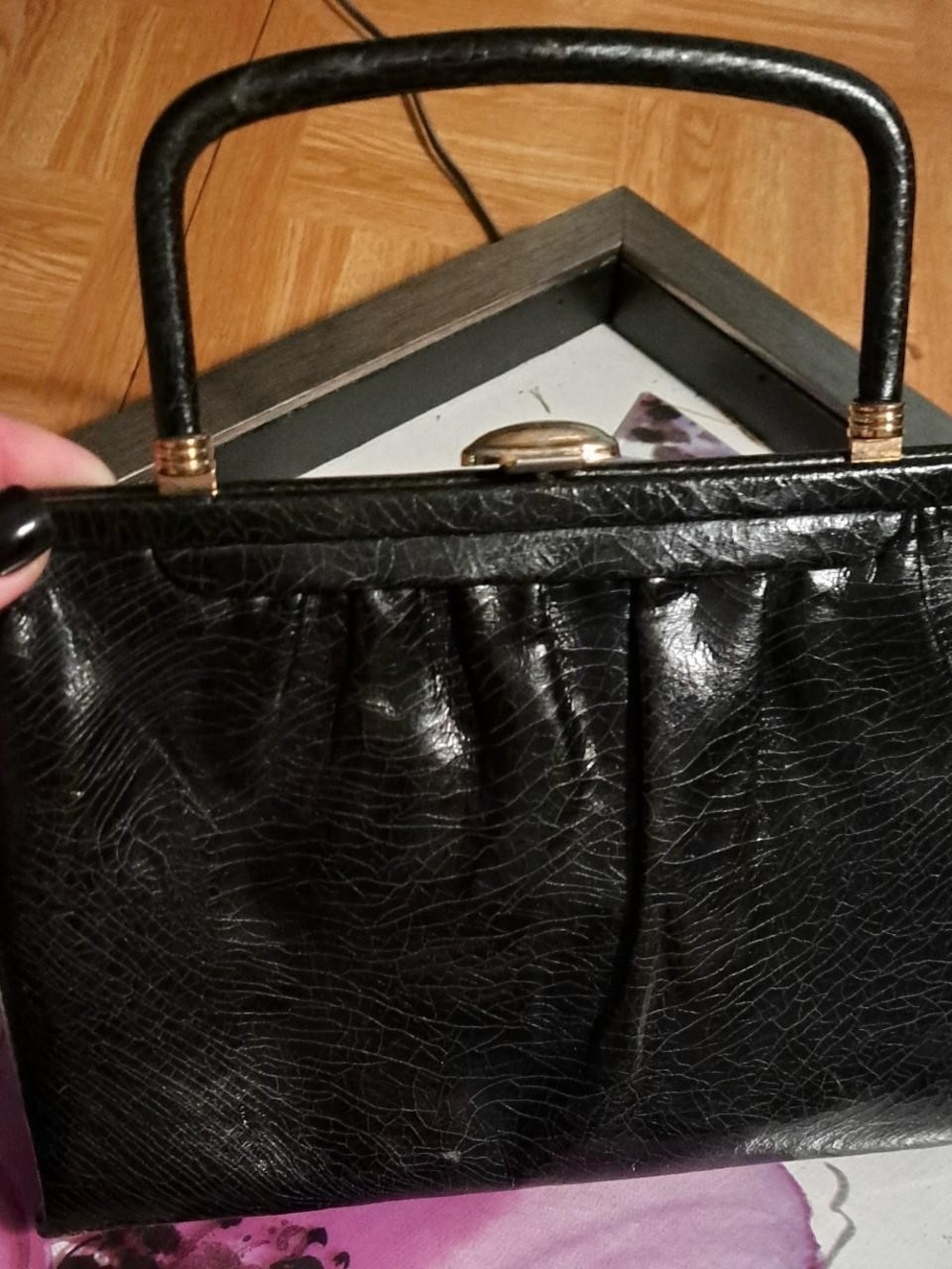 Black Pleated Top-Handle Clutch with Gold Accents